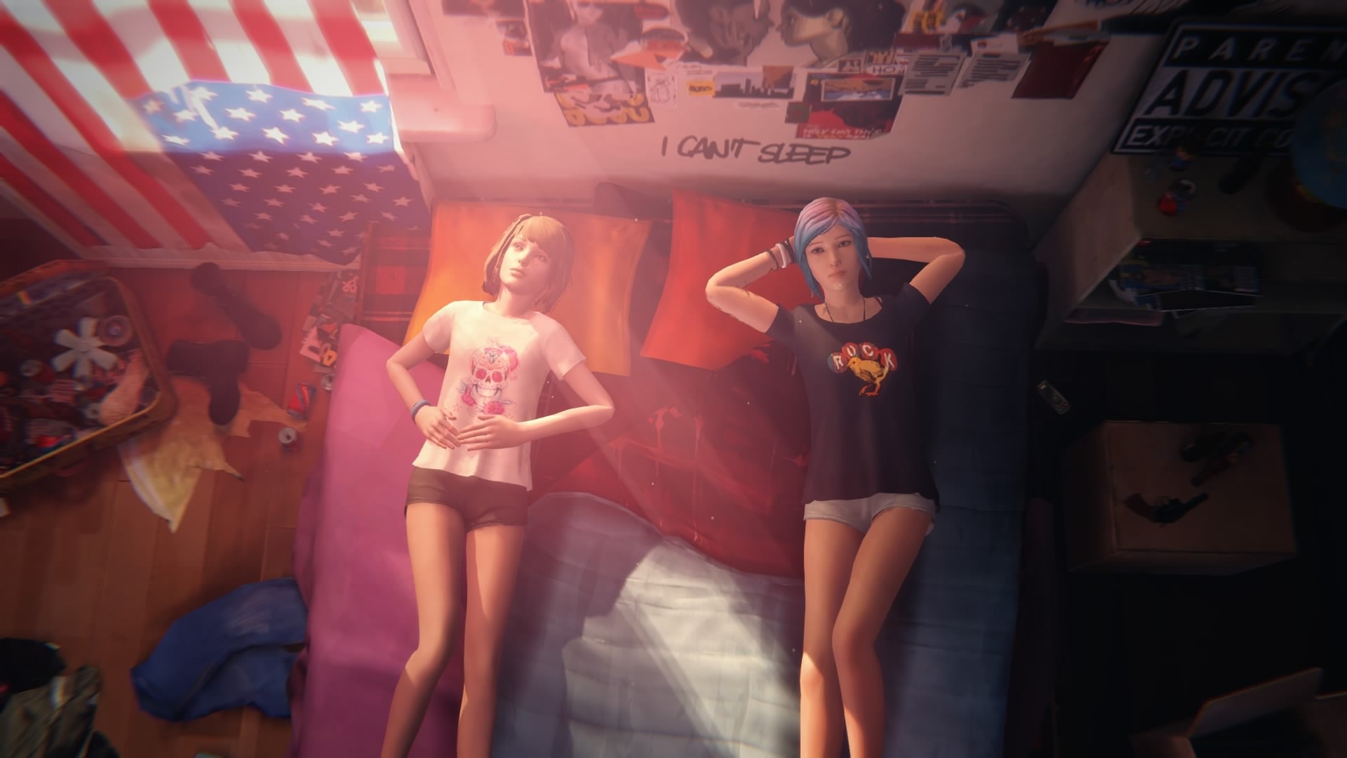 Max and Chloe lay on a bed together in their underwear